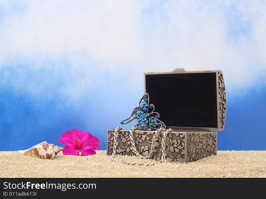 Jewelry Box With Jewelry and Sea Shell on Sand. Jewelry Box With Jewelry and Sea Shell on Sand