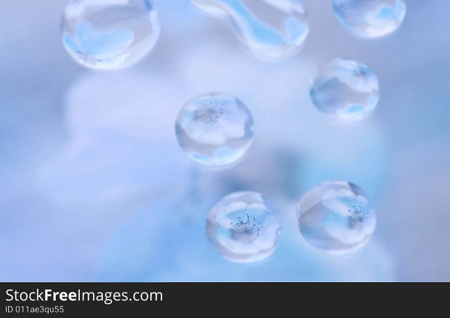 Water drops on a glass surface with a colorful background