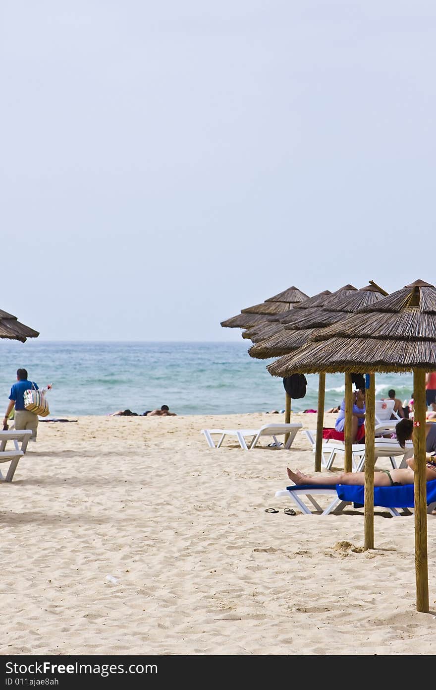 Umbrellas line in a clean beach