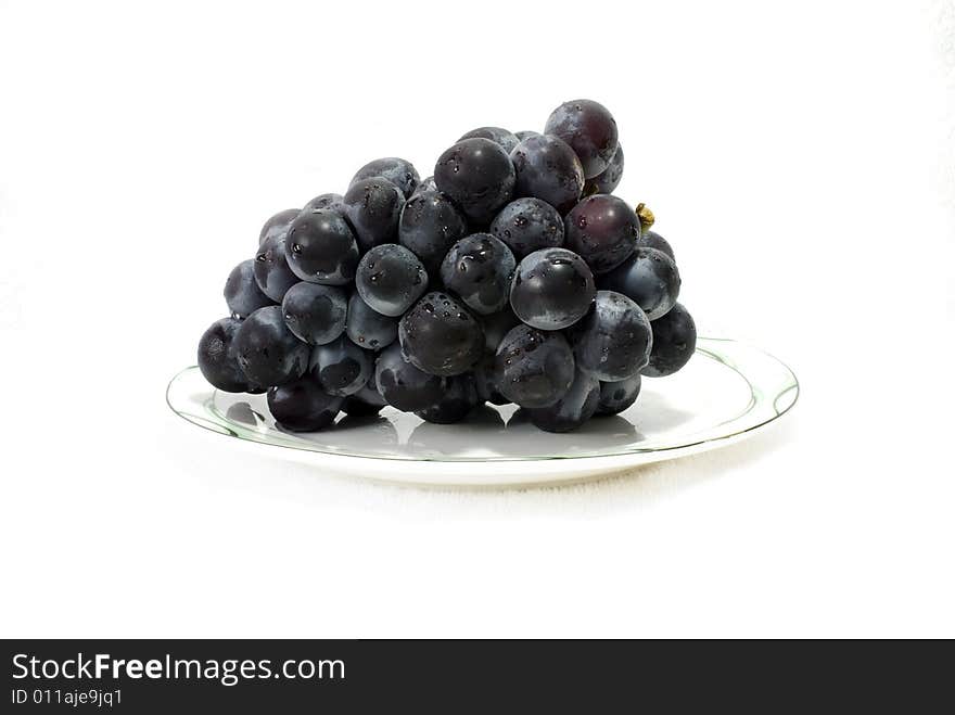 A branch of grape in a dish