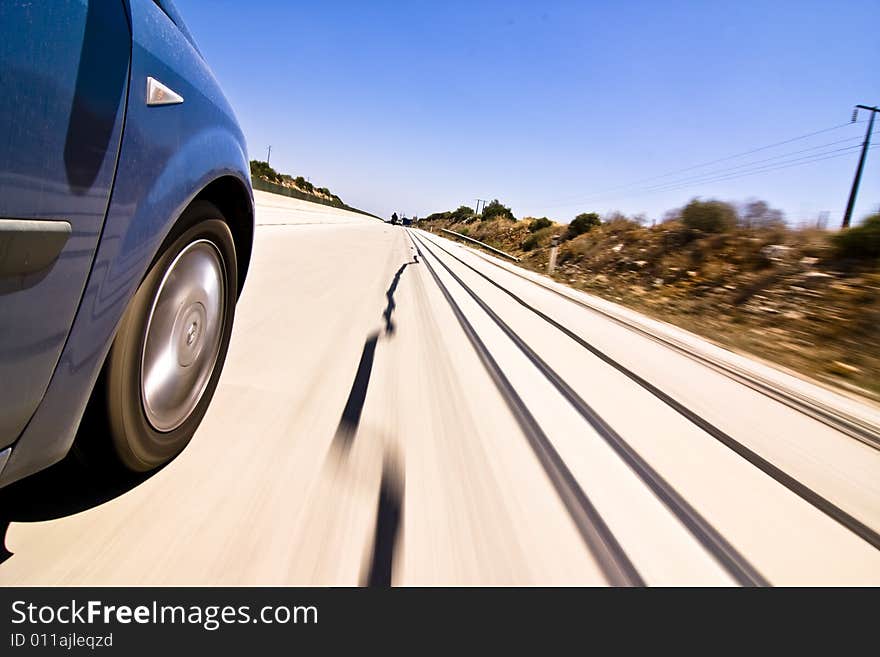 Blue car at high speed on the road. Blue car at high speed on the road