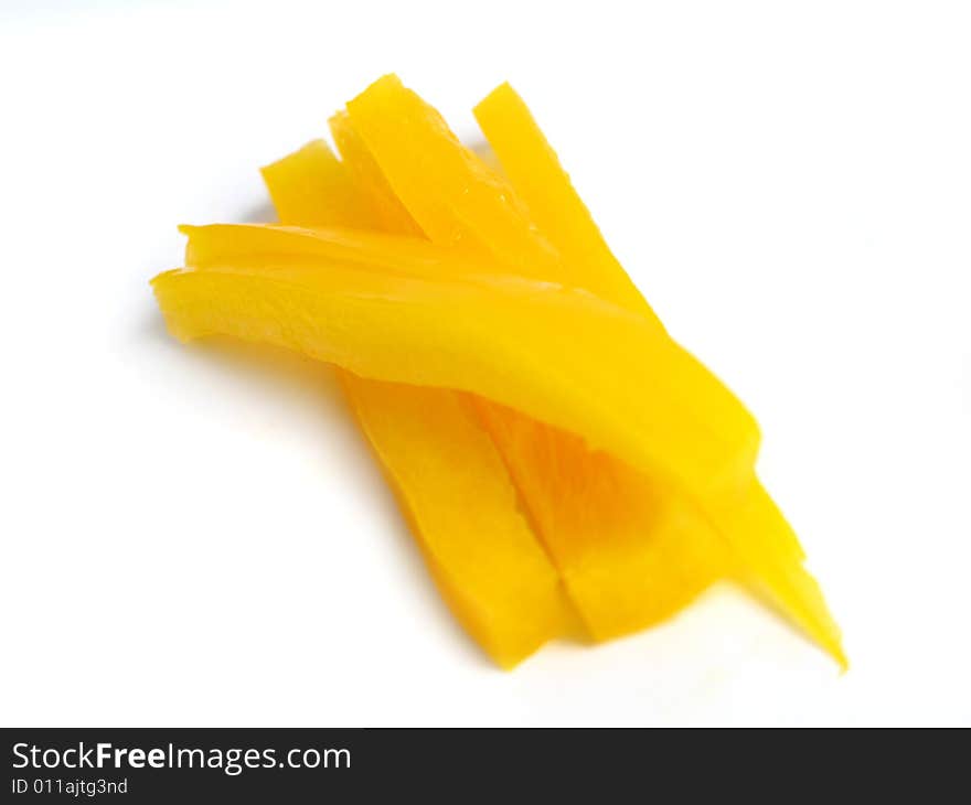 Sliced yellow pepper in sticks, on white background