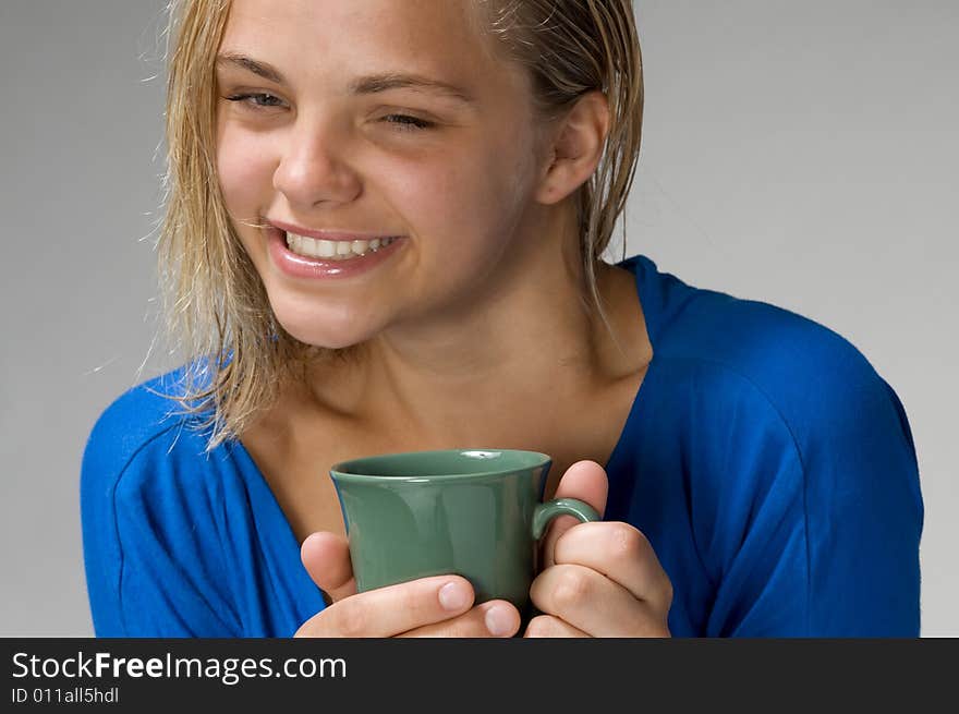 Teenager with the green mug. Teenager with the green mug