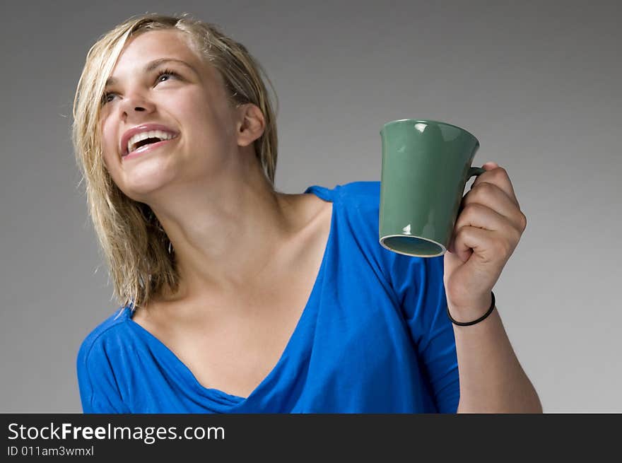 Teenager with the green mug. Teenager with the green mug