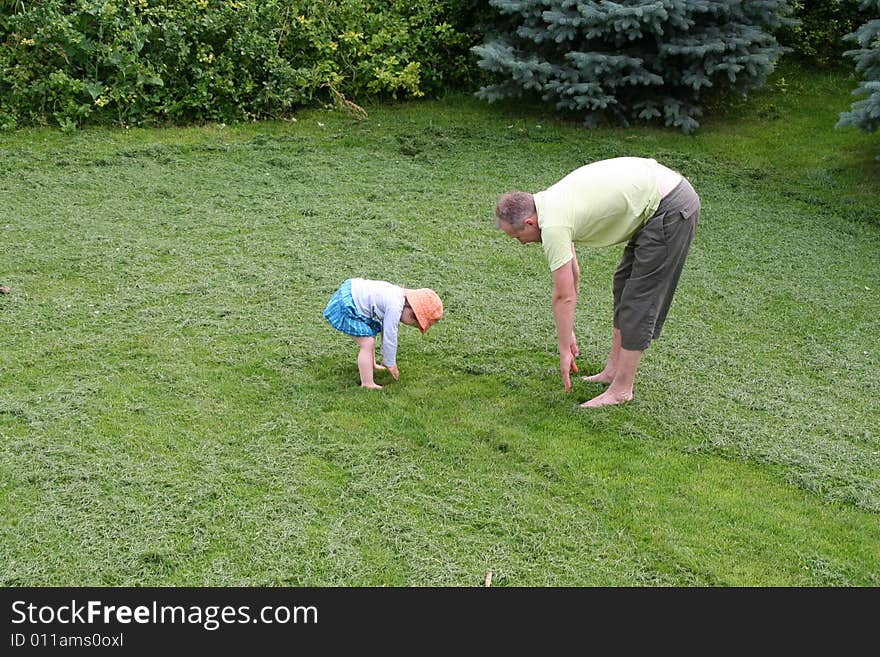 Father and little daughter sporting in the morning outdoor. Father and little daughter sporting in the morning outdoor