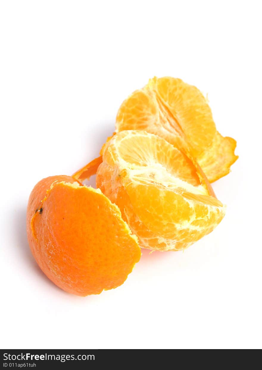 Organic Tangerine peeled and sectioned, on white background