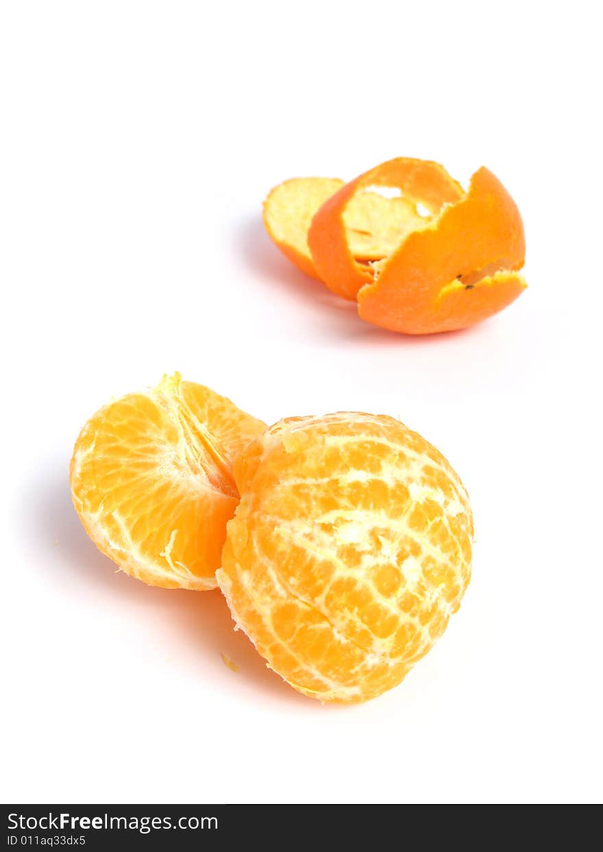 Organic Tangerine peeled and sectioned, on white background