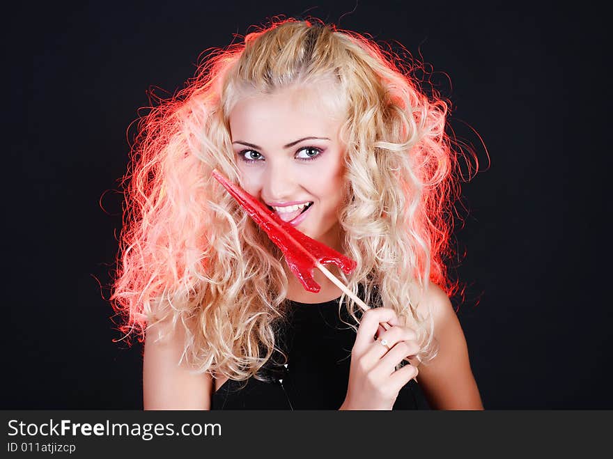 Beauty woman and red candy