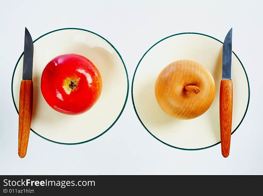 Two apples on dessert plates. Two apples on dessert plates