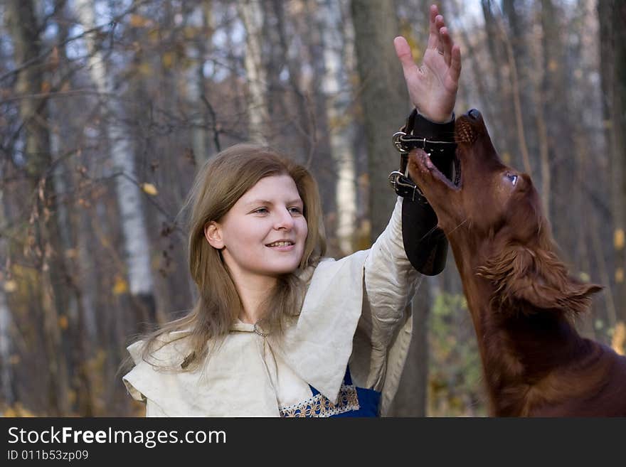 Portrait of the girl and irish setter in autumn forest. Portrait of the girl and irish setter in autumn forest.