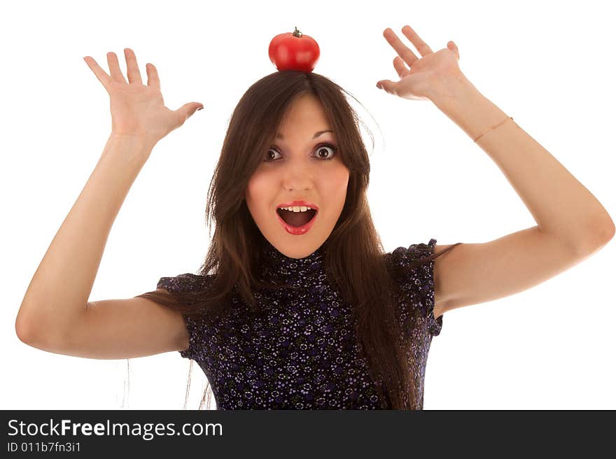 Young beautiful girl with tomato on the white. Young beautiful girl with tomato on the white