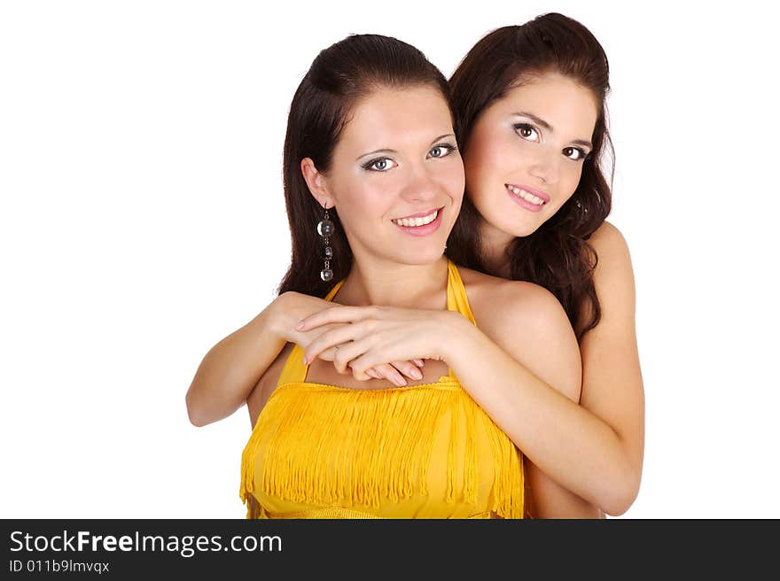 Two beautiful girls in yellow dress on the white. Two beautiful girls in yellow dress on the white