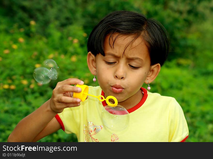 Girl and soap bubbles