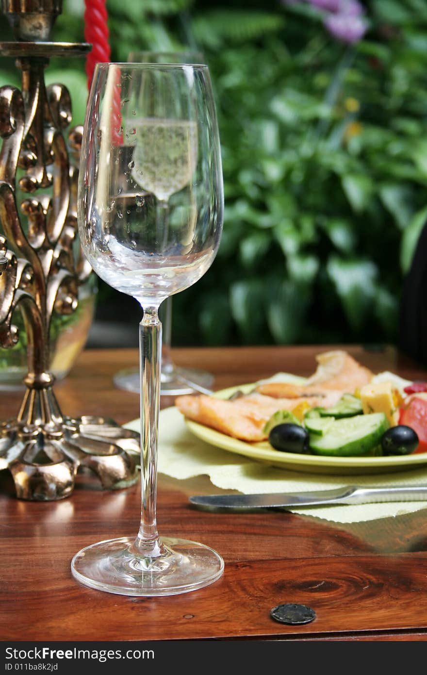 Crystal glass on the table. Outdoor.