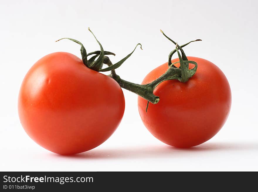 Fresh tomatoes isolated on a white background.