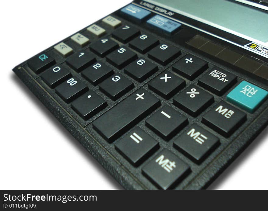 Close-up of a black color calculator on a white background