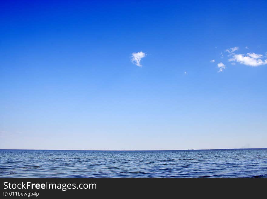 Wave on sea under year blue sky and cloud