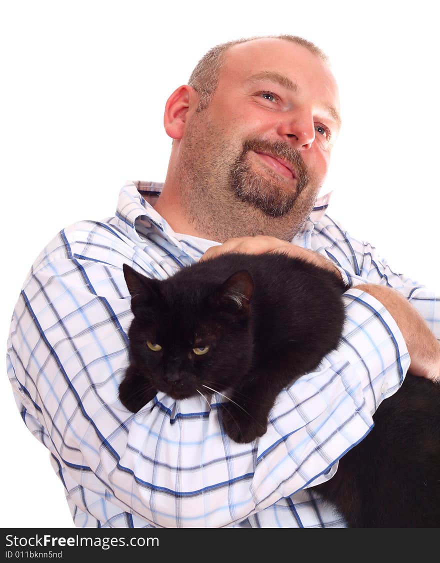 Man holds black cat in hands on white