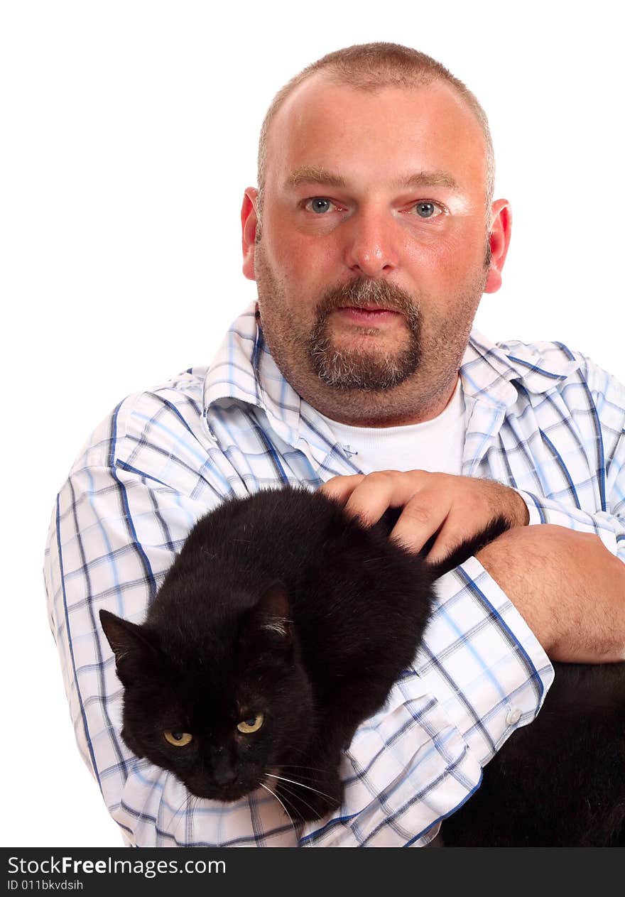 Man holds black cat in hands on white