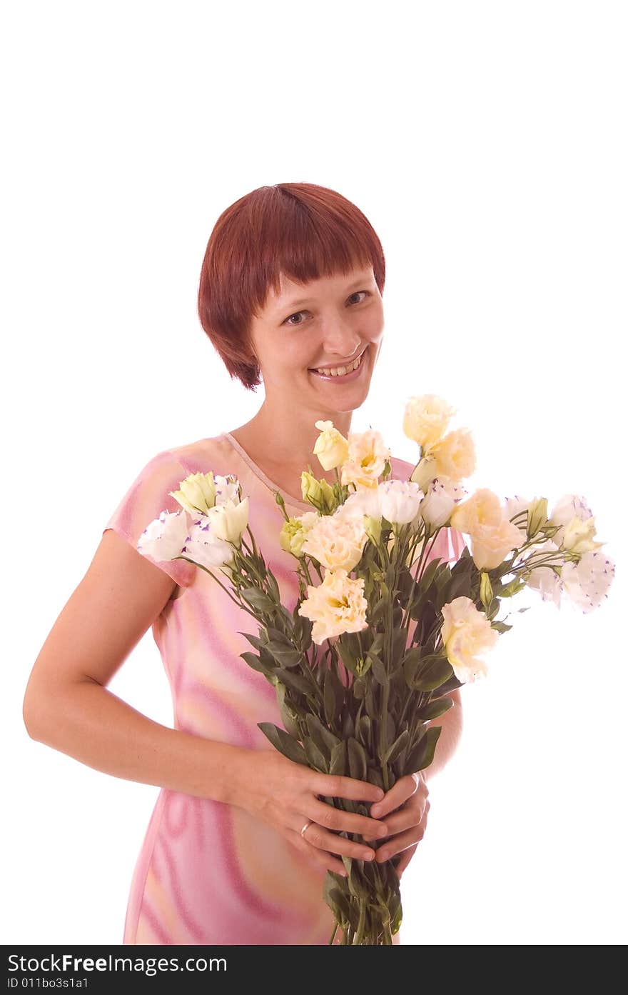 Portrait of red-haired girl with flowers in a high key.