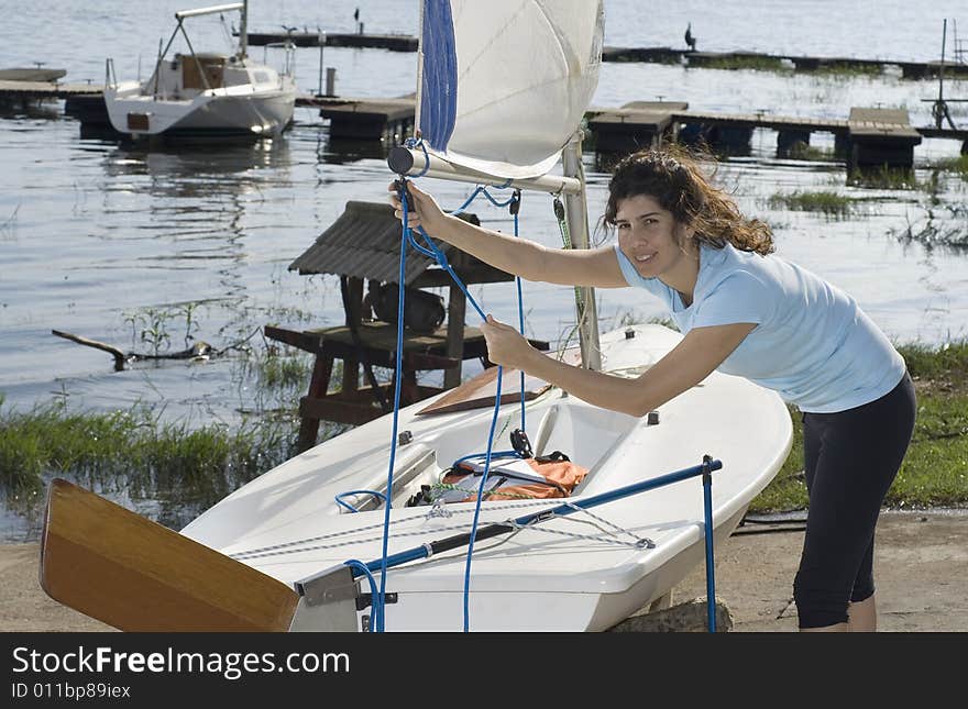 Woman Readying Sailboat - Horizontal