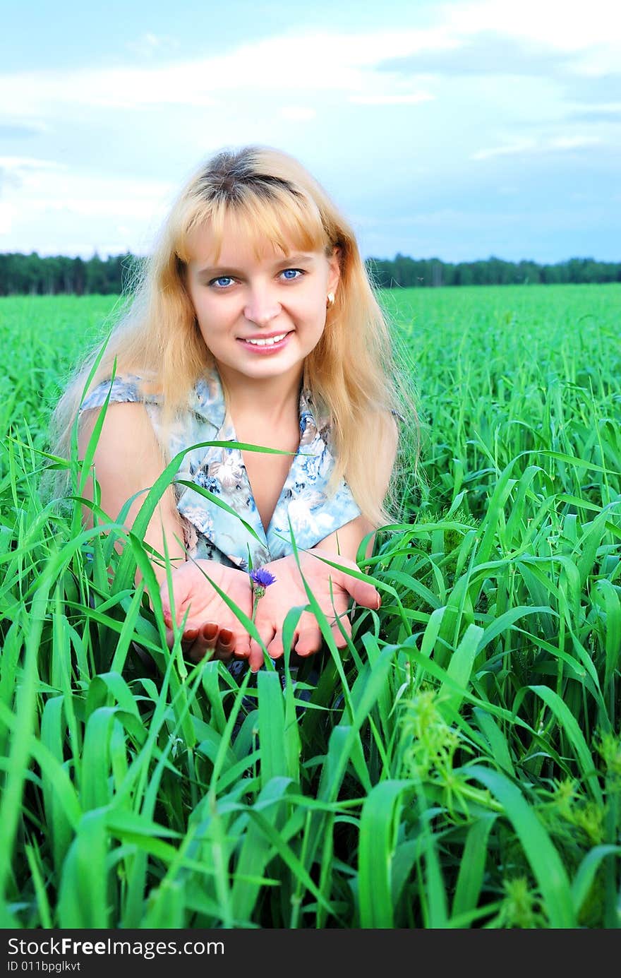 Young woman relaxing on green meadow. Young woman relaxing on green meadow