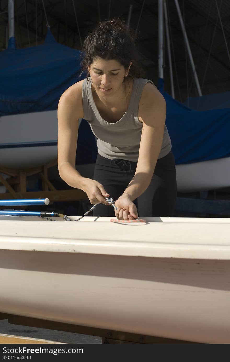 Woman Getting Ready to Sail - Vertical