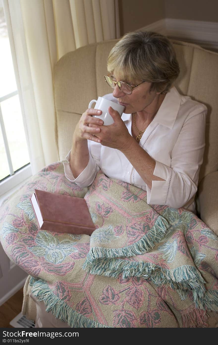 Close in shot of a senior woman relaxing. Close in shot of a senior woman relaxing.