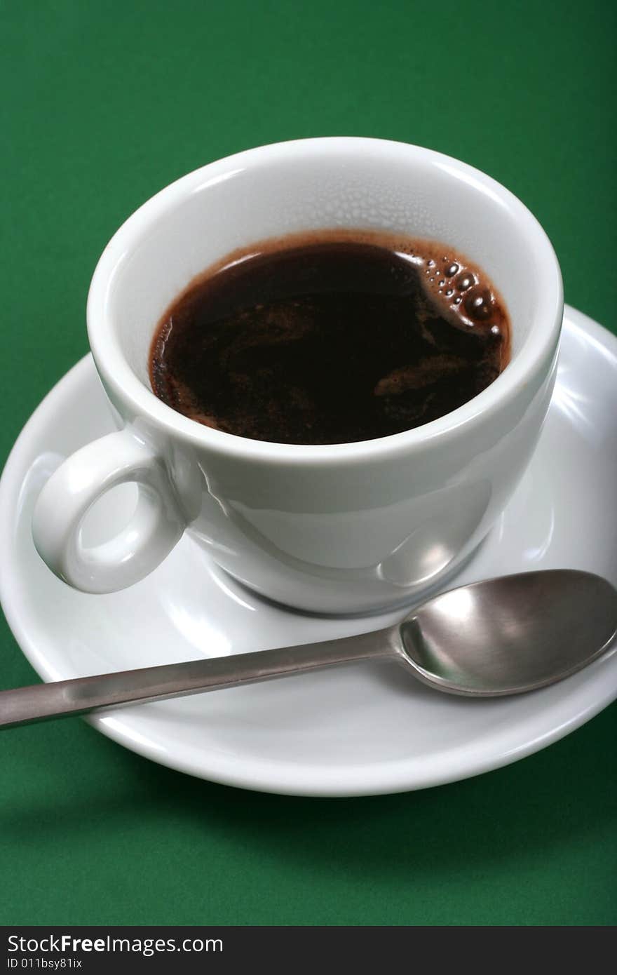 Coffee on green background