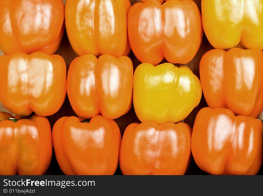 Stacked Bright Red Bell Peppers Filling the Frame