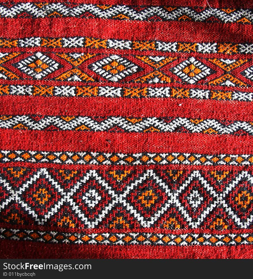 Moroccan carpet texture, red and orange. Moroccan carpet texture, red and orange