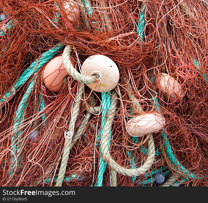 Red net fishing with green ropes