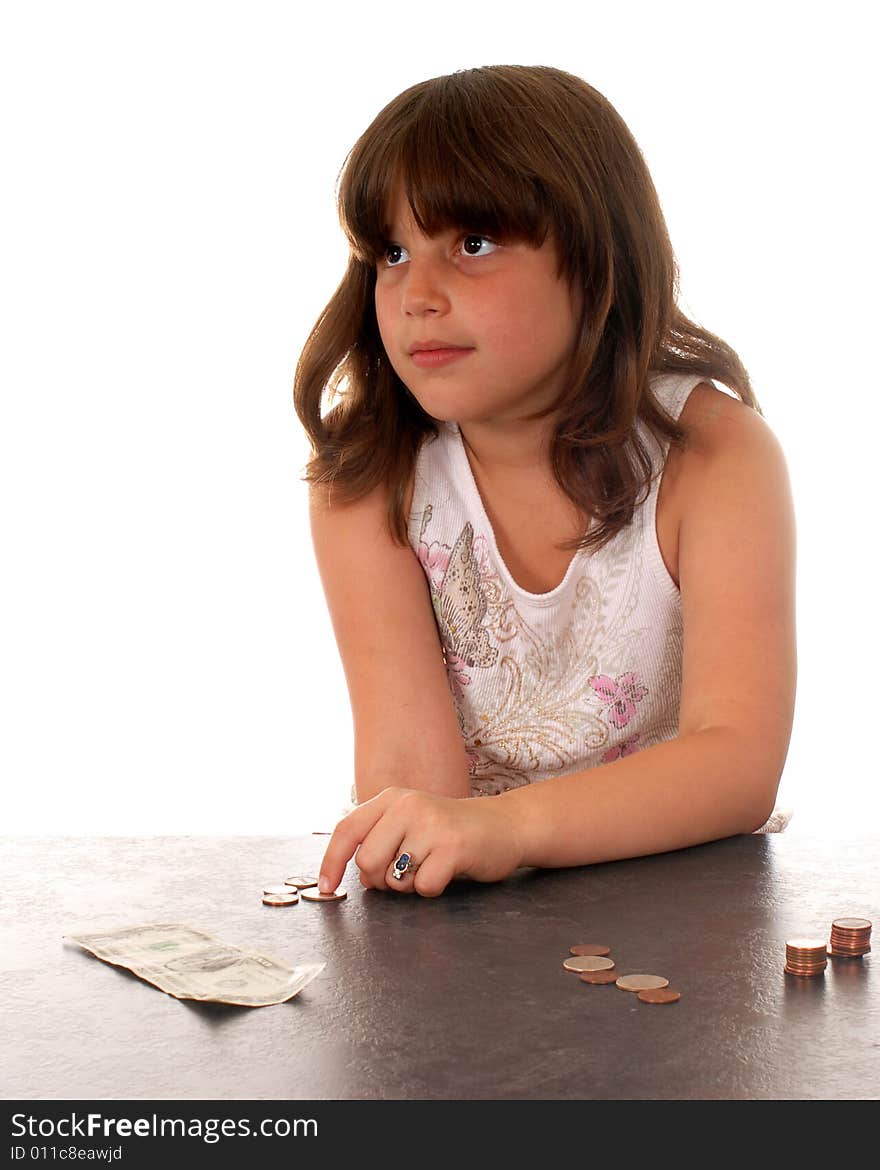 Elementary girl counting her money, wishing she had more for something special. Elementary girl counting her money, wishing she had more for something special.