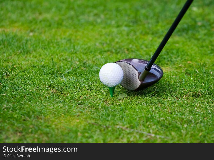 Golf club and ball in teeing position. Golf club and ball in teeing position