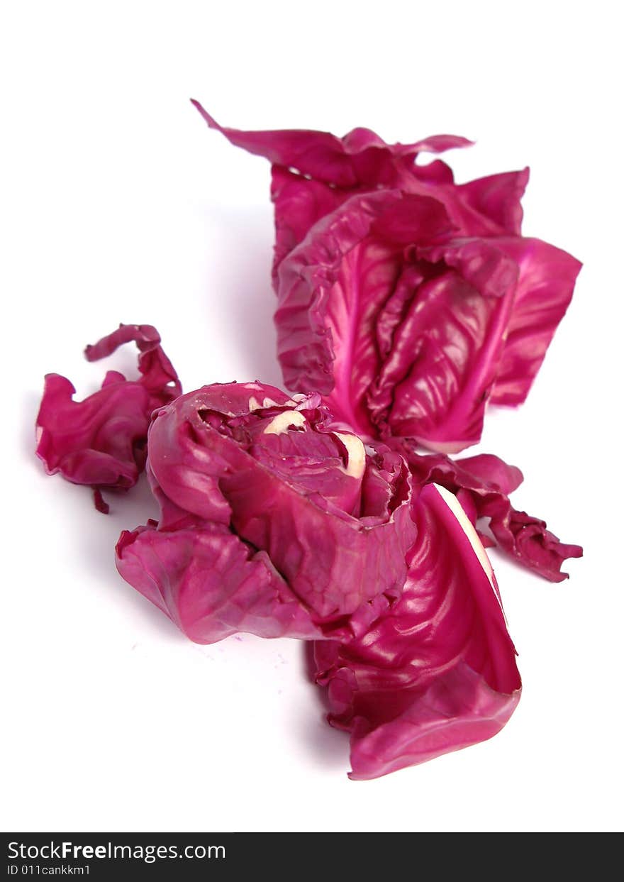 Red cabbage leaves on white background