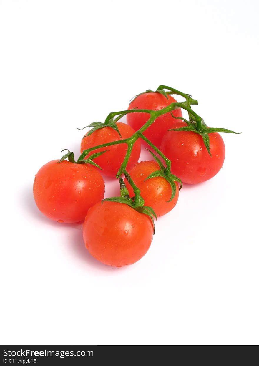 Cherry tomatoes together on a white background