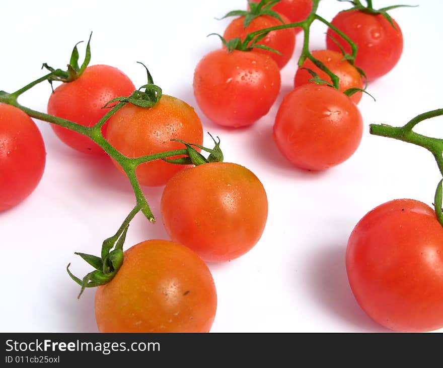 Cherry tomatoes together on a white background