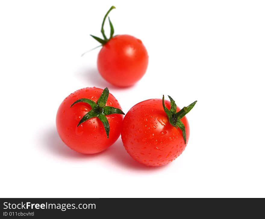 Cherry tomatoes together on a white background