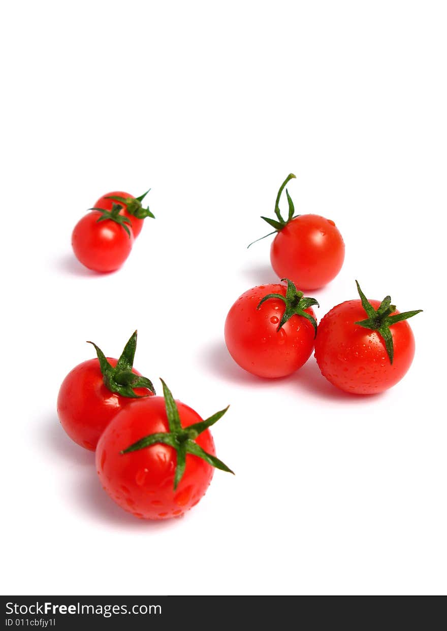 Cherry tomatoes together on a white background