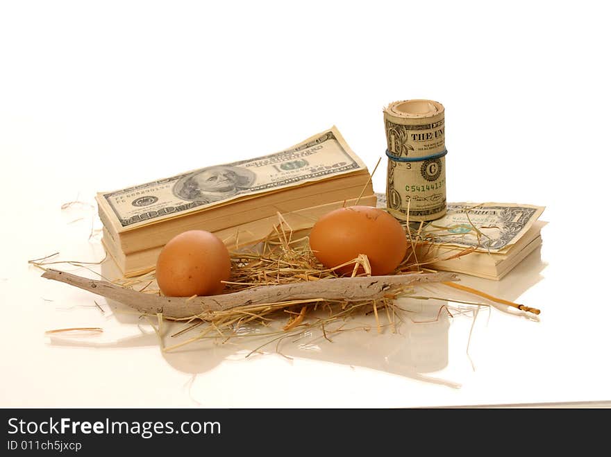 Stack of money and nest eggs