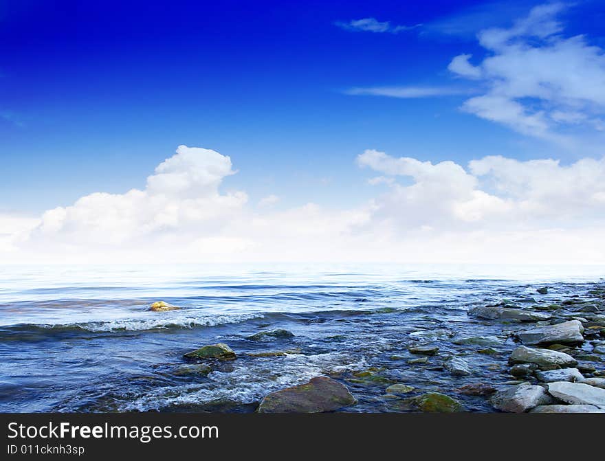 Wave on sea under year blue sky and cloud