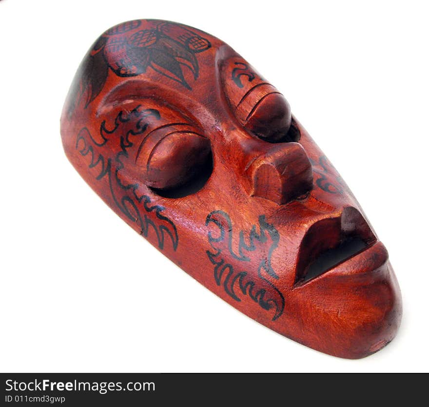 Carved wooden mask on white background