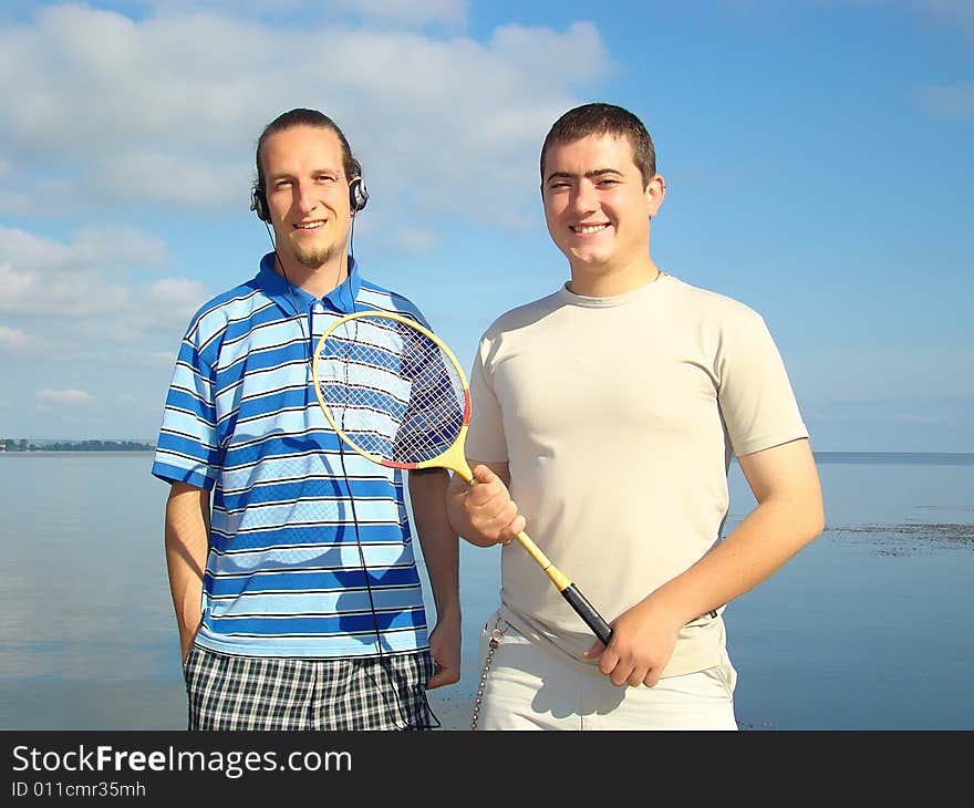 Leisure. Two young men on the riverside. Leisure. Two young men on the riverside.