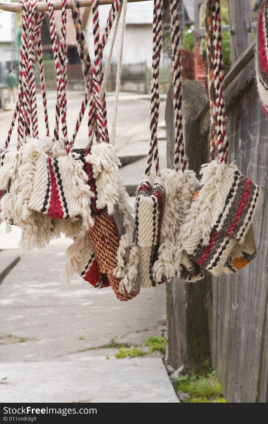 Traditional Romanian bags made of wool.They are hung on the home's wooden fences in the street for selling.They are characteristic for a certain part of Transylvania called Oasului Country.