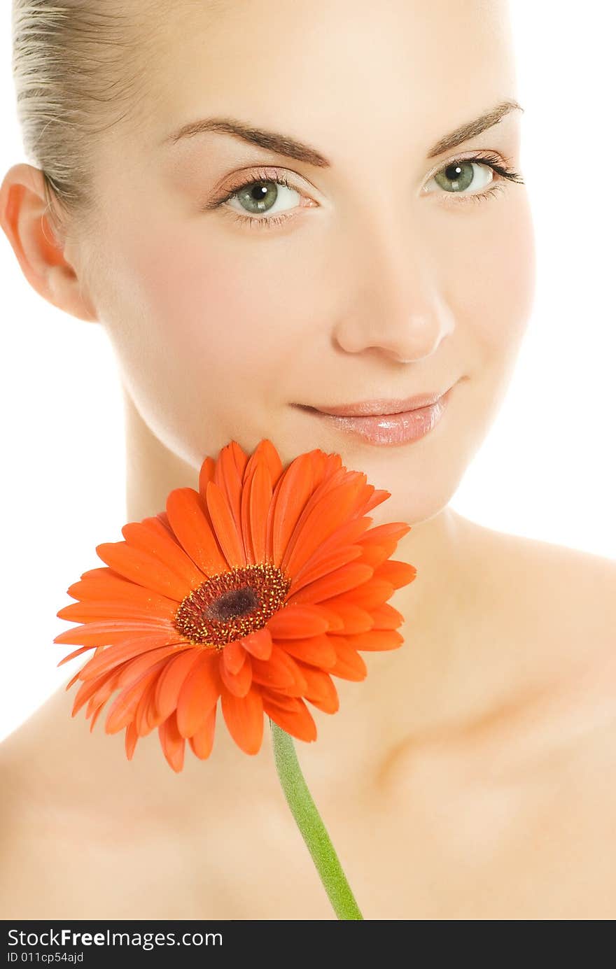 Beautiful young woman with gerber flower isolated on white background