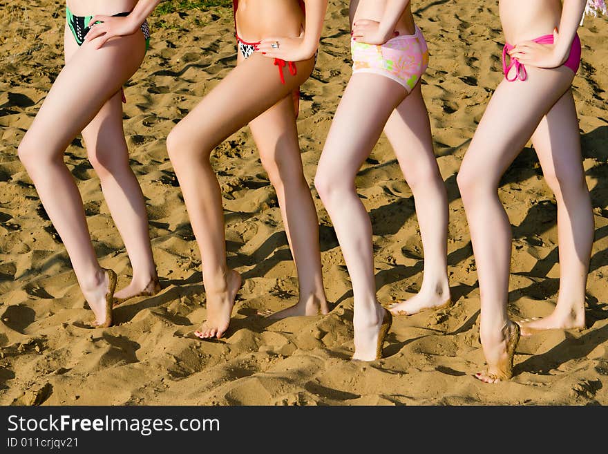 Beautiful female legs on sand. Beautiful female legs on sand