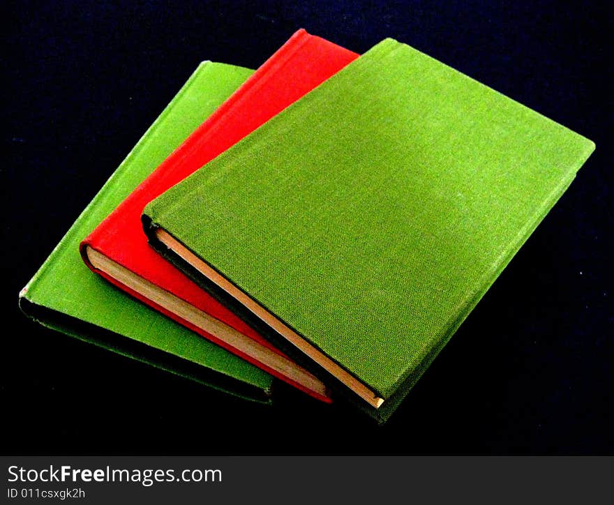 A photographic image of three books. A photographic image of three books
