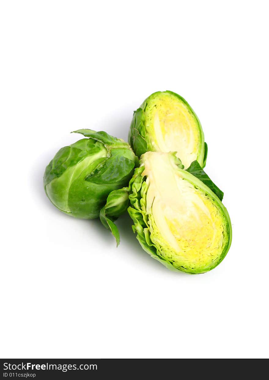 Fresh organic Brussels sprouts on white background