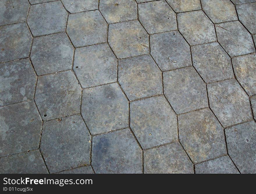 Close-up of new old-style pavement of stoneblocks (bricks) of grey color