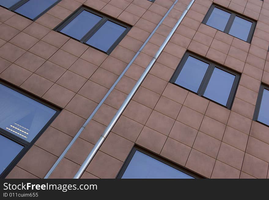 View of new modern office building slabbed with tiles. View of new modern office building slabbed with tiles